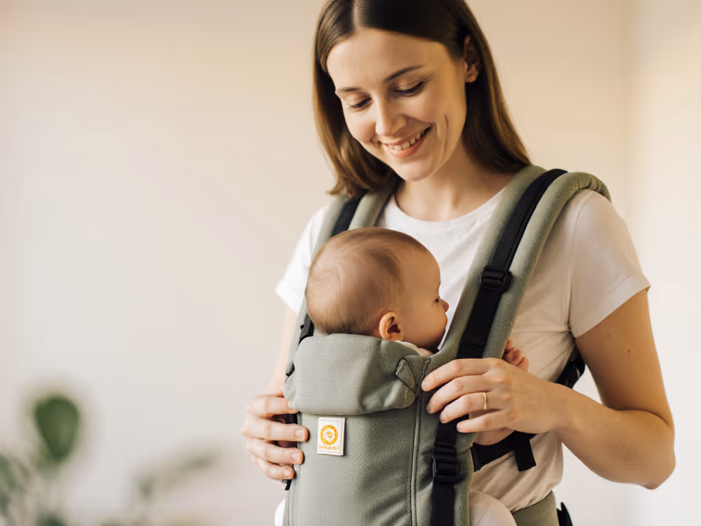 caregiver_smiling_while_checking_babys_position_in_carrier